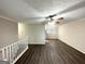 Open living room with hardwood floors, ceiling fan, and kitchen view at 2852 Port Royal Ln, Decatur, GA 30034