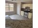 Kitchen with granite countertops, stainless steel appliances, and vinyl flooring at 10690 Tara Village Way, Jonesboro, GA 30238