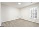 Bright bedroom with neutral carpeting and large window at 6864 Fielder Rd, Rex, GA 30273