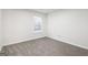 Bright bedroom featuring neutral walls and carpeting at 6864 Fielder Rd, Rex, GA 30273