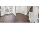 Front entry with hardwood floors and stairs leading upstairs at 6864 Fielder Rd, Rex, GA 30273
