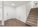 Entryway with hardwood floors and staircase leading upstairs at 6864 Fielder Rd, Rex, GA 30273