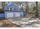 Newly painted blue house with a two-car garage at 6864 Fielder Rd, Rex, GA 30273