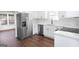 Modern kitchen with white cabinets, stainless steel appliances, and marble countertops at 6864 Fielder Rd, Rex, GA 30273