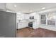 Renovated kitchen featuring white shaker cabinets and stainless steel appliances at 6864 Fielder Rd, Rex, GA 30273