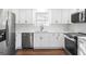 Updated kitchen with white cabinets, stainless steel appliances, and marble countertops at 6864 Fielder Rd, Rex, GA 30273