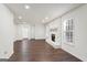 Spacious living room with hardwood floors and a stone fireplace at 6864 Fielder Rd, Rex, GA 30273