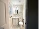 Small bathroom with white vanity and toilet at 2030 Fargo Se Pl, Atlanta, GA 30316