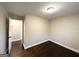 Simple bedroom with dark hardwood floors and neutral walls at 2030 Fargo Se Pl, Atlanta, GA 30316