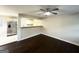 Open living room with dark hardwood floors and kitchen views at 2030 Fargo Se Pl, Atlanta, GA 30316
