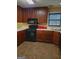 Spacious kitchen featuring wood cabinets, tile floors, and modern appliances at 1034 Bettina Sw Ct, Mableton, GA 30126