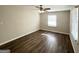 Bright bedroom with dark laminate wood flooring and ceiling fan at 3800 Clovis Nw Ct, Atlanta, GA 30331