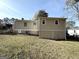 Back of house with storage and additional space at 3800 Clovis Nw Ct, Atlanta, GA 30331