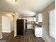 Renovated kitchen with granite countertops and white cabinets at 3800 Clovis Nw Ct, Atlanta, GA 30331
