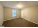 Well-lit bedroom with neutral carpet at 4864 Brookstone Pkwy, Ellenwood, GA 30294