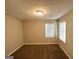 Bedroom with two windows and neutral decor at 4864 Brookstone Pkwy, Ellenwood, GA 30294