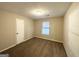Bright bedroom featuring a window with blinds at 4864 Brookstone Pkwy, Ellenwood, GA 30294