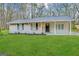 Ranch home with newly landscaped lawn at 4864 Brookstone Pkwy, Ellenwood, GA 30294