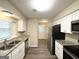 Updated kitchen with stainless steel appliances at 4864 Brookstone Pkwy, Ellenwood, GA 30294