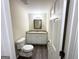 Bathroom with granite countertop, white cabinets, and toilet at 2252 Wellington Hills Way, Snellville, GA 30039