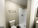 Updated bathroom with shower, toilet, and granite vanity at 2252 Wellington Hills Way, Snellville, GA 30039