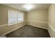 Bright bedroom with neutral walls, carpet, and window blinds at 2252 Wellington Hills Way, Snellville, GA 30039