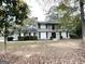 Two-story house with balcony, freshly painted, and landscaping at 2252 Wellington Hills Way, Snellville, GA 30039