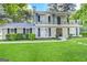Two-story house with a balcony, freshly painted, and a well-maintained lawn at 2252 Wellington Hills Way, Snellville, GA 30039