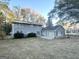 Gray brick house with large backyard and sliding glass doors at 2252 Wellington Hills Way, Snellville, GA 30039