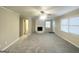 Spacious living room with fireplace and neutral colors at 2252 Wellington Hills Way, Snellville, GA 30039