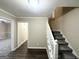 Interior view showing staircase with dark hardwood floors and light walls at 2252 Wellington Hills Way, Snellville, GA 30039