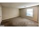 Simple bedroom with neutral decor, carpet, and window at 2312 Leslie Brook Dr, Decatur, GA 30035