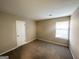 Well-lit bedroom with neutral walls and carpet flooring at 2312 Leslie Brook Dr, Decatur, GA 30035