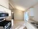 Eat-in kitchen with white cabinets, stainless steel appliances, and tile floor at 2312 Leslie Brook Dr, Decatur, GA 30035