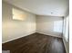 Bright living room with dark laminate floors and neutral walls at 2312 Leslie Brook Dr, Decatur, GA 30035