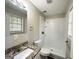 Updated bathroom with granite vanity and a shower/tub combo at 4448 Malibu Dr, Decatur, GA 30035