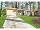 Brick ranch home with a long driveway and a spacious yard at 4448 Malibu Dr, Decatur, GA 30035
