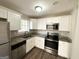 Modern kitchen with granite countertops and stainless steel appliances at 4448 Malibu Dr, Decatur, GA 30035