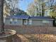 Ranch style home with green siding and stone accents at 2987 Medina Dr, Jonesboro, GA 30236