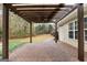 Brick patio with pergola and backyard view at 409 Bellway Ct, Tyrone, GA 30290