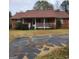 Brick ranch house with front porch and carport at 240 Chambers Rd, Mcdonough, GA 30253