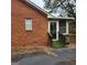 Brick home with a screened porch and ramp at 240 Chambers Rd, Mcdonough, GA 30253