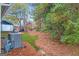 Large backyard with mature trees and landscaping at 270 Jeff Davis Pl, Fayetteville, GA 30214