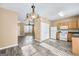 Dining area with chandelier and view into kitchen and living room at 102 Timber Ridge Dr, Cartersville, GA 30121