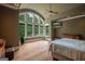 Main bedroom with hardwood floors and a wall of windows at 320 Massengale Rd, Brooks, GA 30205