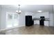 Kitchen and dining area with black appliances and French doors at 321 Summerwood Ln, Stockbridge, GA 30281