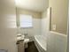 Clean bathroom featuring a bathtub, toilet, and granite vanity at 239 Silver Springs Sw Cir, Atlanta, GA 30310