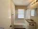 Updated bathroom with granite vanity and tub shower at 239 Silver Springs Sw Cir, Atlanta, GA 30310