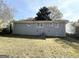 Gray house exterior with a yard and central air conditioning unit at 239 Silver Springs Sw Cir, Atlanta, GA 30310