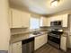 Modern kitchen with stainless steel appliances and granite countertops at 239 Silver Springs Sw Cir, Atlanta, GA 30310